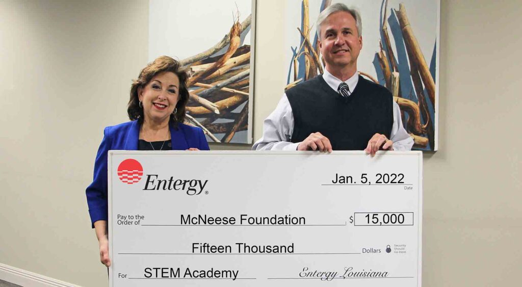 On hand for the presentation are, from left, Margaret Harris, Entergy customer service manager II, and Dr. Wade Rousse, McNeese vice president for university advancement. McNeese Photo