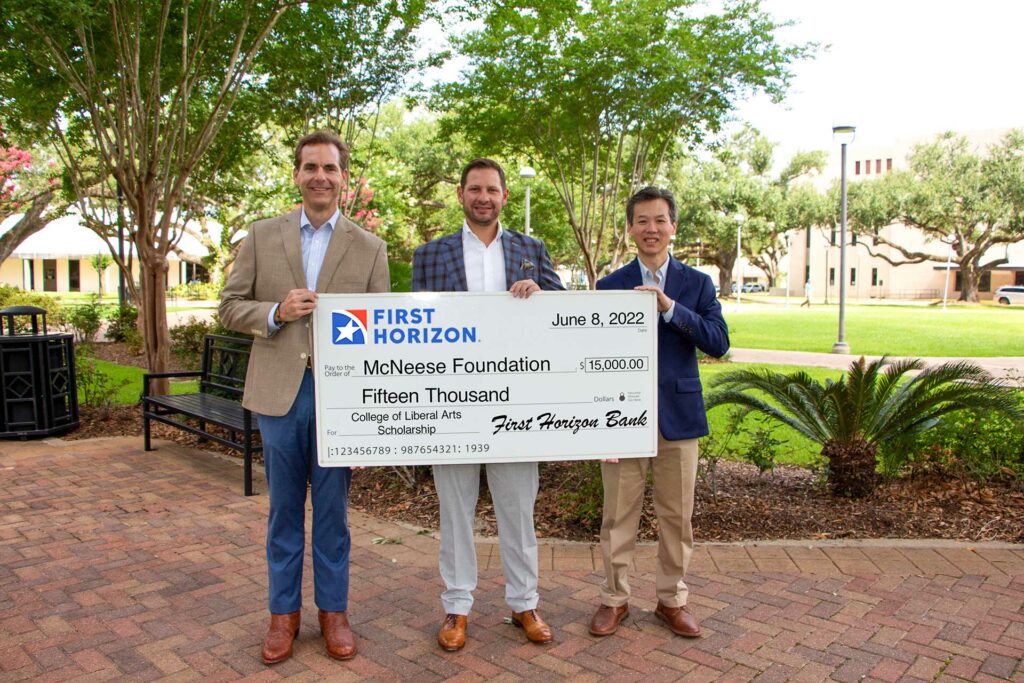 from left, Will Reid, branch manager; Steven Perez, incoming Southwest Louisiana market president, and Dr. Michael Buckles, dean of the coll
