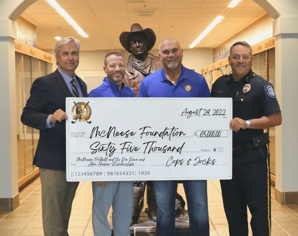 McNeese representatives accepting a donation.