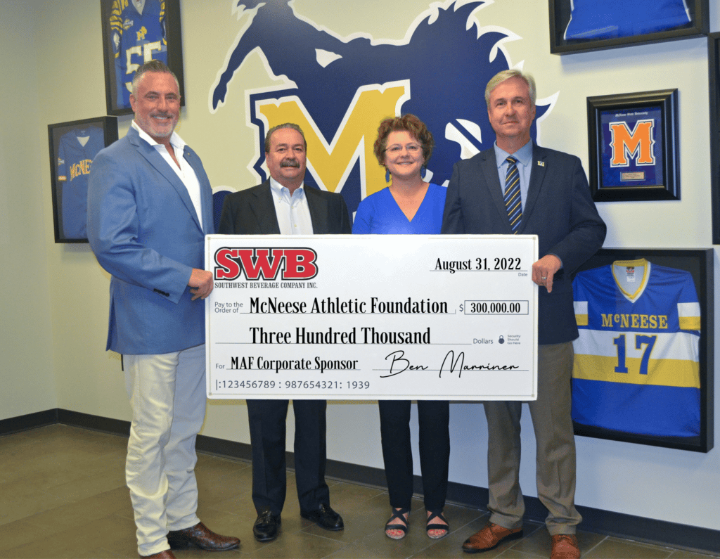 McNeese representatives accepting a donation