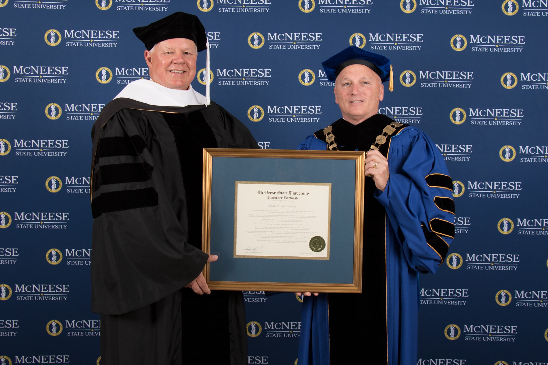 McNeese State University President Dr. Daryl V. Burckel, right, presented Charles E. “Chuck” Kleckley with an honorary Doctor of Humane Letters degree during McNeese’s spring commencement ceremonies Friday, May 12, at the McNeese Legacy Center.