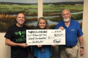 Mark LeFevre, World of Colorz; Lisa Reinauer, professor of art at McNeese; and Richard Reid, vice president for university advancement and executive vice president for the McNeese Foundation.