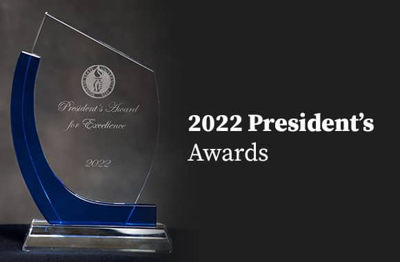 2022 President's Award for Excellence trophy with blue accents on a dark background.