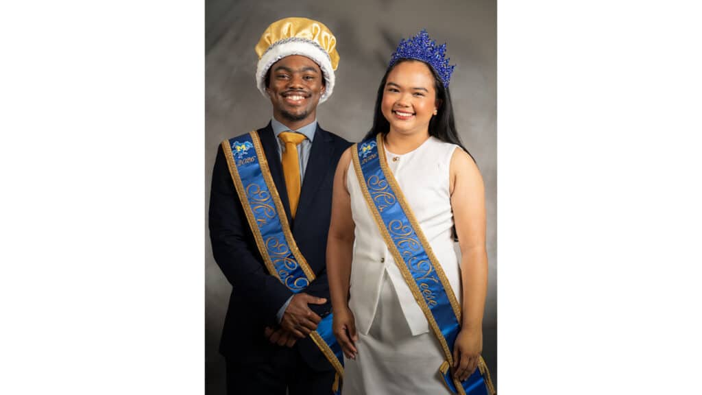 Omari Francis and Lianne Montelibano stand with their crowns and sashes for being named Mr. and Ms. McNeese.
