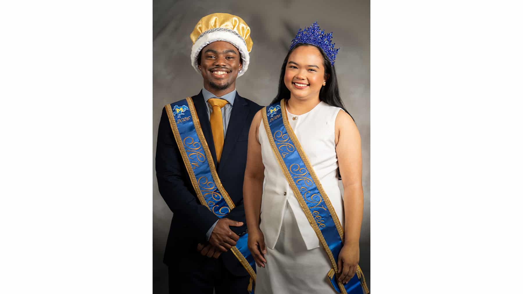 Omari Francis and Lianne Montelibano stand with their crowns and sashes for being named Mr. and Ms. McNeese.