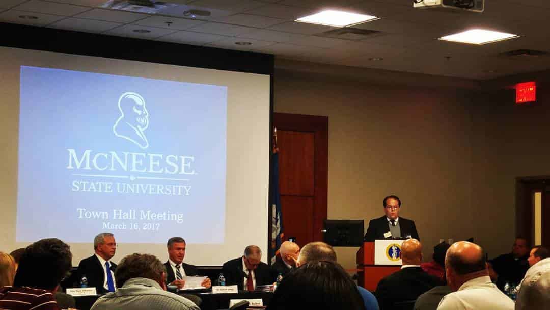 McNeese State University town hall meeting, March 16, 2017, with panelists and speaker at podium.
